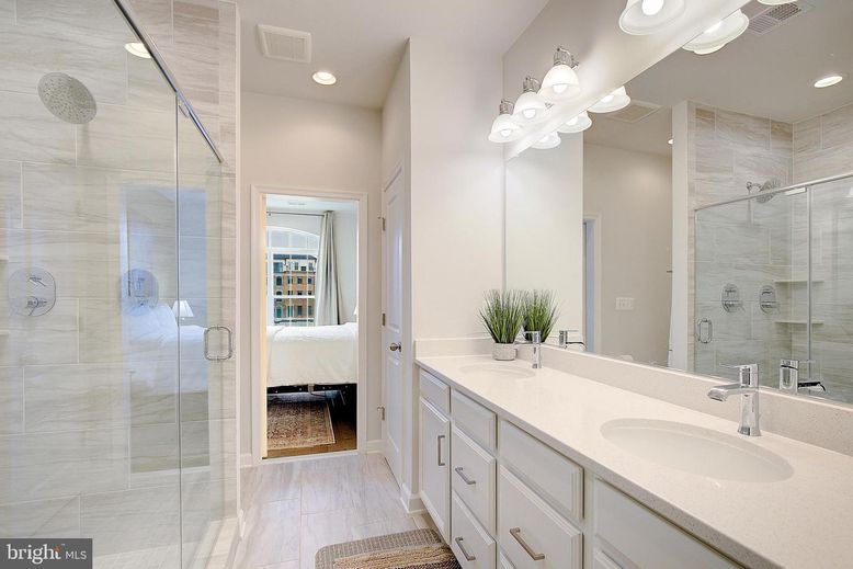 Bathroom, Dual Sink Vanities, Glass Shower, Interior, Recessed Lighting, Wood Texture Flooring