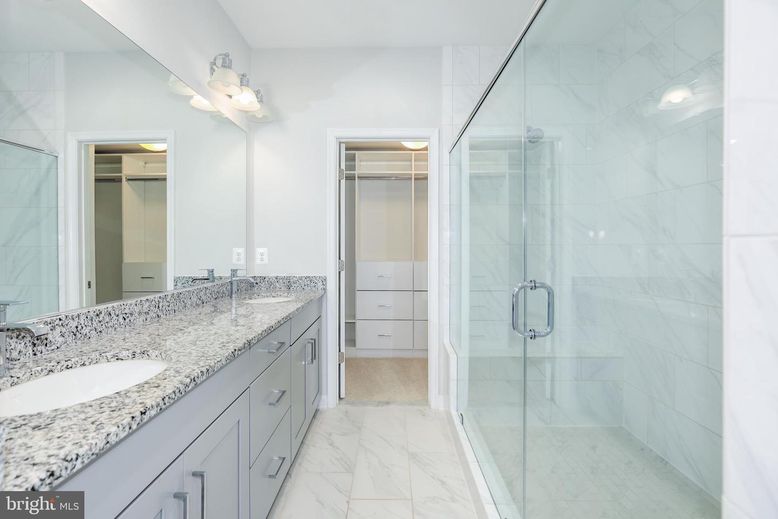 Bathroom, Dual Sink Vanities, Glass Shower, Interior, Marble, Marble Walls, Recessed Lighting