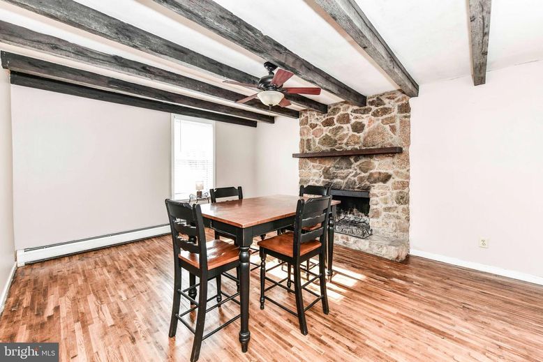 Dining room, Fireplace, Interior, Stone Walls, Wooden Beams, Wood Texture Flooring