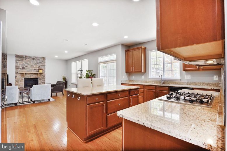 Dining room, Fireplace, Interior, Kitchen, Living room, Recessed Lighting, Stone Walls, Wood Texture Flooring