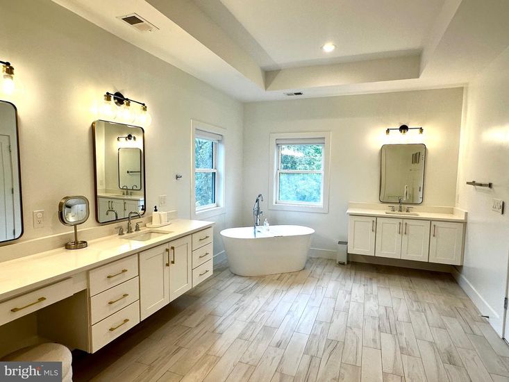 Bathroom, Dual Sink Vanities, Free Standing Baths, Interior, Recessed Lighting, Wood Texture Flooring