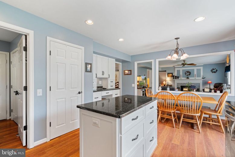 Chandelier, Dining room, Fireplace, Interior, Kitchen, Recessed Lighting, Wood Texture Flooring