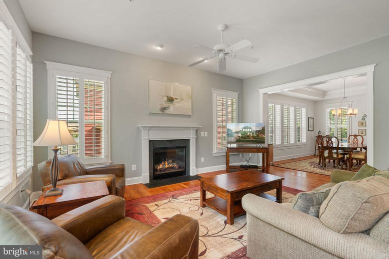 Chandelier, Dining room, Fireplace, Interior, Living room, Pendant Lights, Recessed Lighting, Wood Texture Flooring