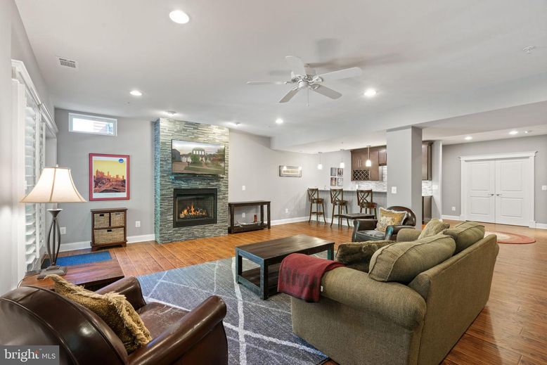 Dining room, Fireplace, Interior, Kitchen, Living room, Recessed Lighting, Stone Walls, Wood Texture Flooring