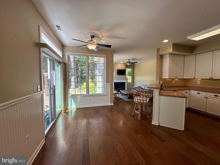 Dining room, Fireplace, Interior, Kitchen, Recessed Lighting, Wood Texture Flooring