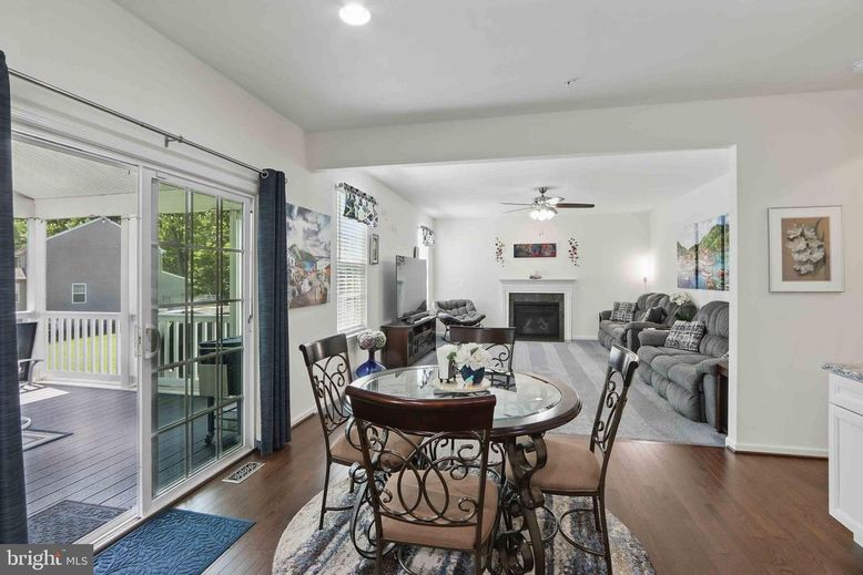 Dining room, Fireplace, Interior, Living room, Recessed Lighting, Wood Texture Flooring