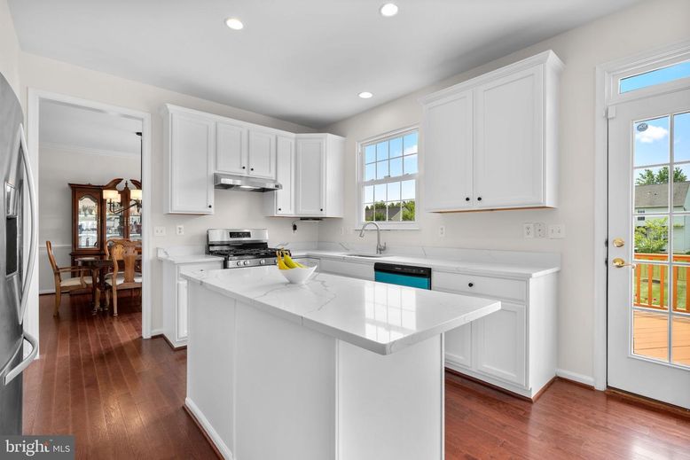 Dining room, Interior, Kitchen, Recessed Lighting, Stainless Steel Appliances, Wood Texture Flooring