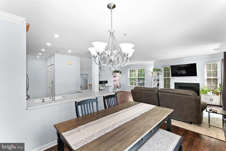 Chandelier, Dining room, Fireplace, Interior, Living room, Recessed Lighting, Wood Texture Flooring