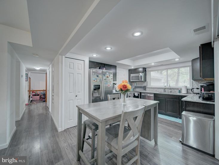 Dining room, Interior, Kitchen, Recessed Lighting, Stainless Steel Appliances, Wood Texture Flooring