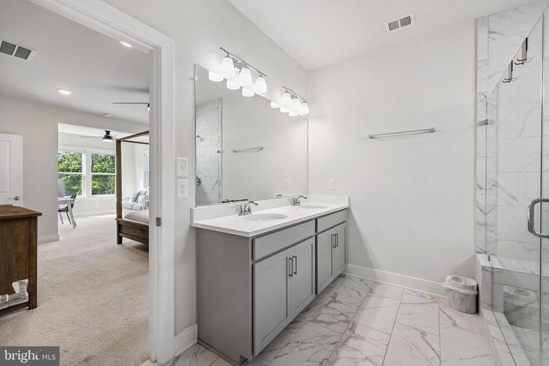 Bathroom, Dual Sink Vanities, Glass Shower, Interior, Marble, Marble Walls, Recessed Lighting