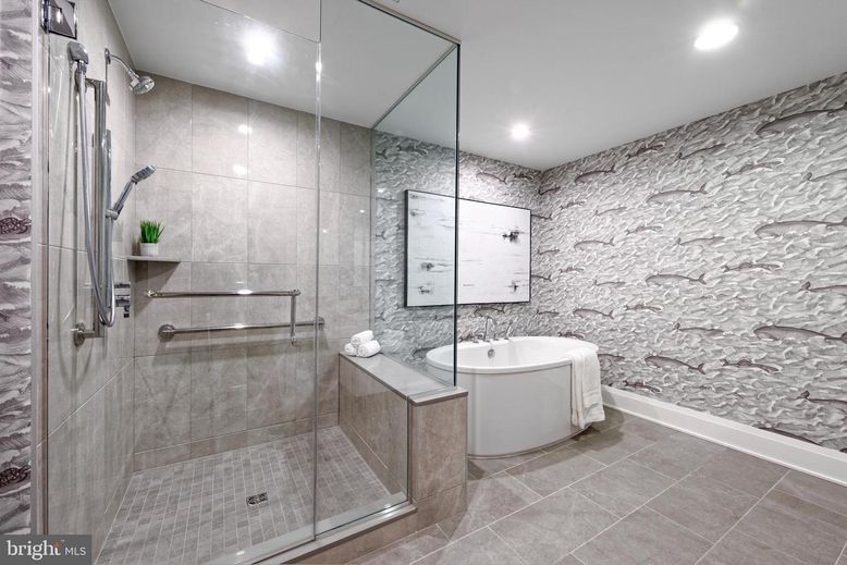 Bathroom, Free Standing Baths, Glass Shower, Interior, Recessed Lighting, Stone Walls