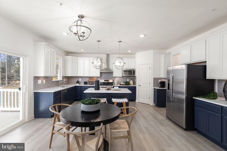 Chandelier, Dining room, Interior, Kitchen, Pendant Lights, Recessed Lighting, Stainless Steel Appliances, Wood Texture Flooring