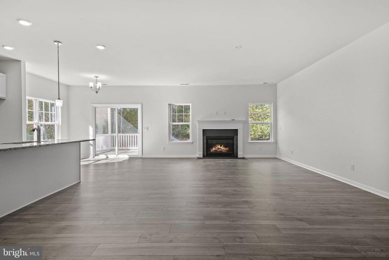Empty room, Fireplace, Interior, Pendant Lights, Recessed Lighting, Wood Texture Flooring