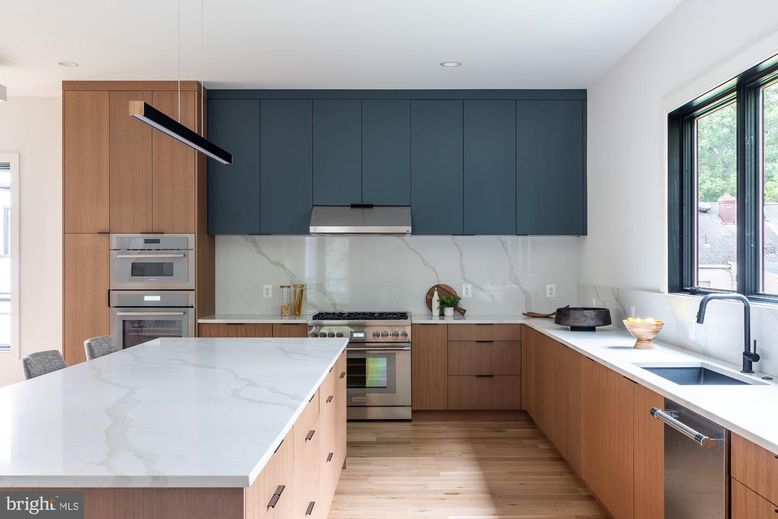 Interior, Kitchen, Marble Walls, Recessed Lighting, Stainless Steel Appliances, Wood Texture Flooring