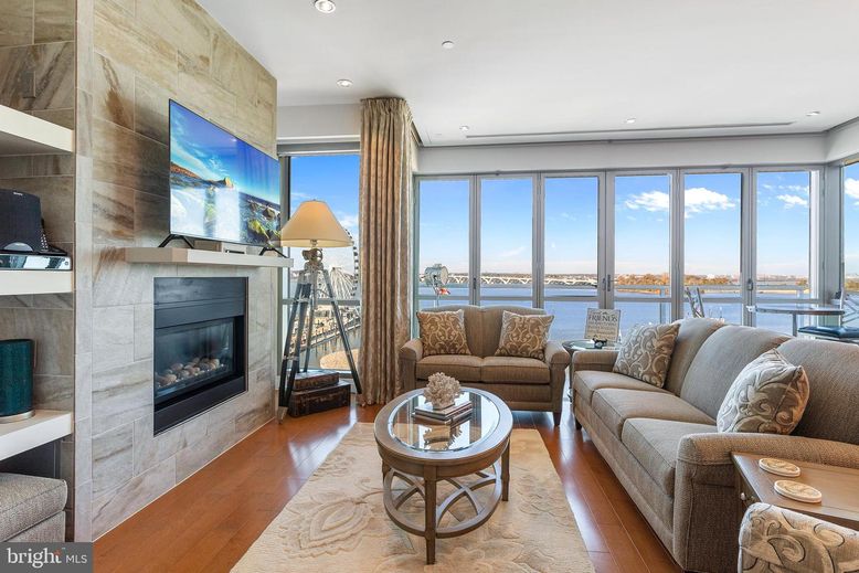 Fireplace, Interior, Living room, Recessed Lighting, Stone Walls, Water, Wood Texture Flooring