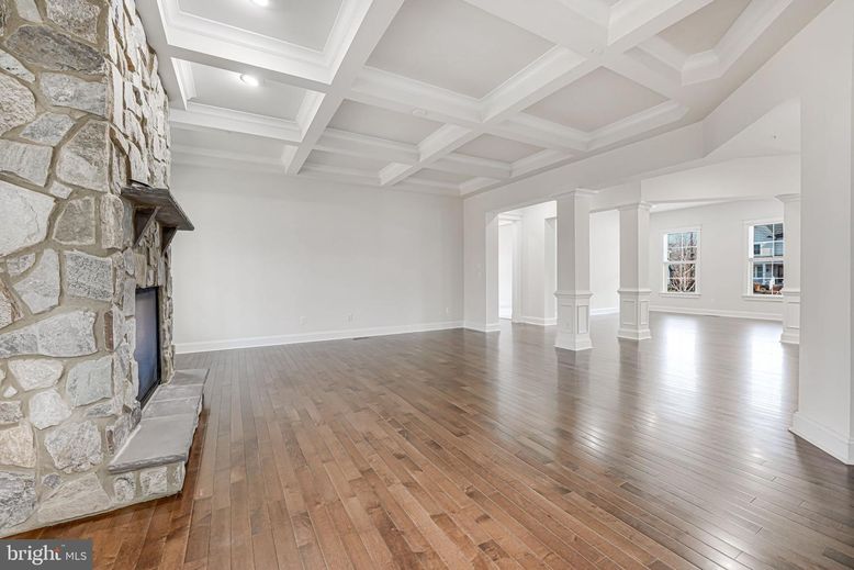 Empty room, Fireplace, Interior, Recessed Lighting, Stone Walls, Wood Texture Flooring
