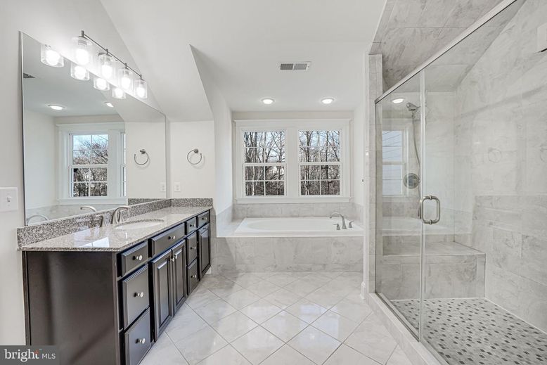 Bathroom, Dual Sink Vanities, Glass Shower, Interior, Marble Walls, Recessed Lighting