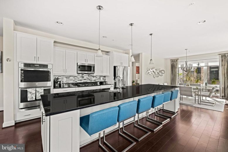 Chandelier, Dining room, Interior, Kitchen, Pendant Lights, Recessed Lighting, Stainless Steel Appliances, Wood Texture Flooring