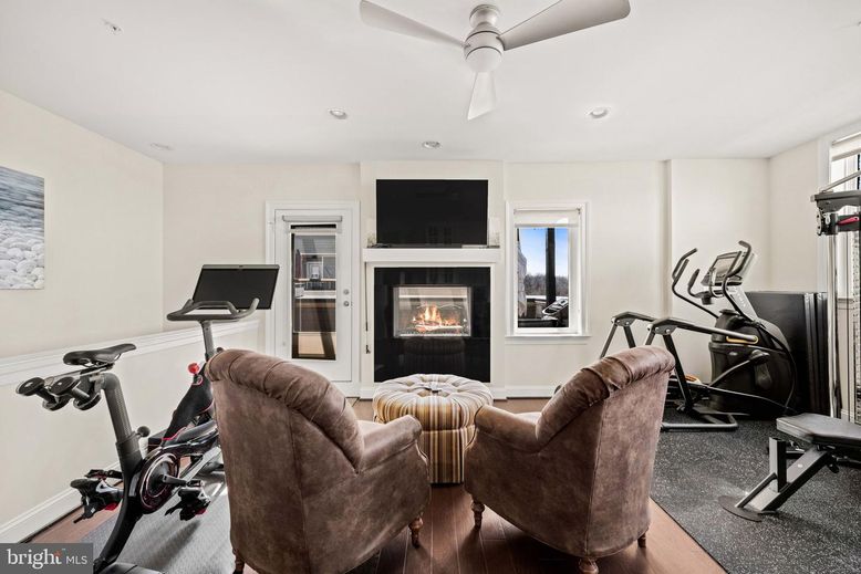 Fireplace, Fitness Equipment, Interior, Living room, Recessed Lighting, Wood Texture Flooring