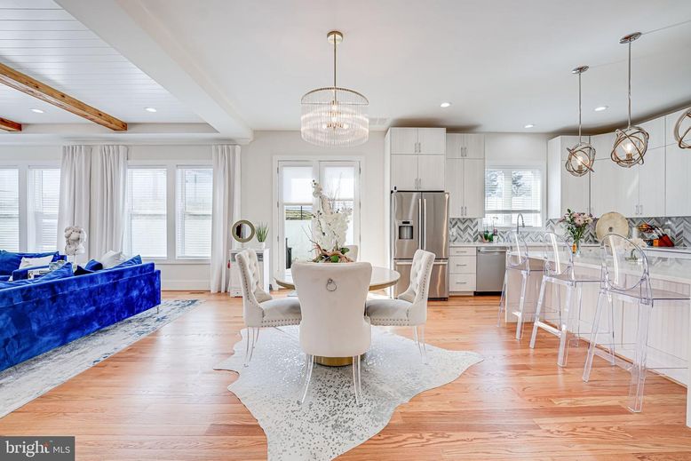 Chandelier, Dining room, Interior, Kitchen, Living room, Pendant Lights, Recessed Lighting, Stainless Steel Appliances, Wooden Beams, Wood Texture Flooring