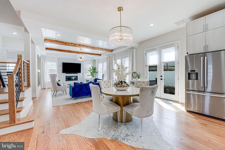 Chandelier, Dining room, Fireplace, Interior, Kitchen, Living room, Recessed Lighting, Stainless Steel Appliances, Wooden Beams, Wood Texture Flooring