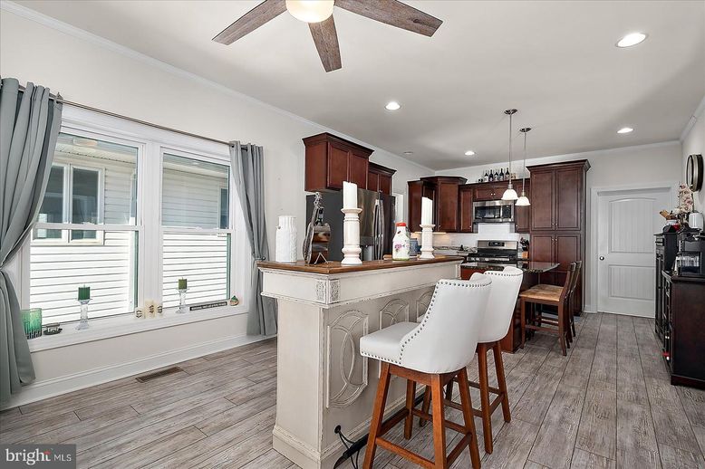 Dining room, Interior, Kitchen, Pendant Lights, Recessed Lighting, Stainless Steel Appliances, Wood Texture Flooring