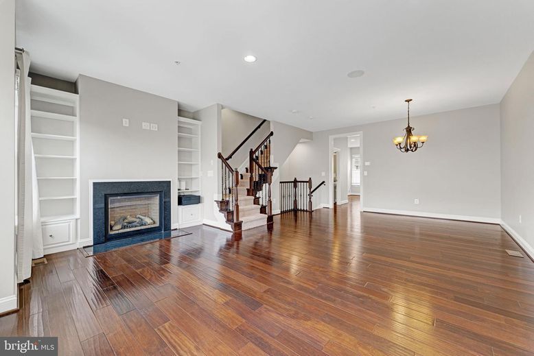 Chandelier, Empty room, Fireplace, Interior, Recessed Lighting, Wood Texture Flooring