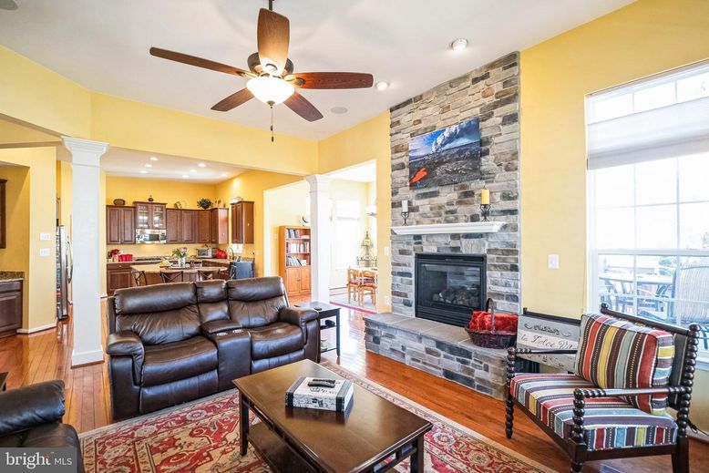 Fireplace, Interior, Kitchen, Living room, Recessed Lighting, Stone Walls, Wood Texture Flooring