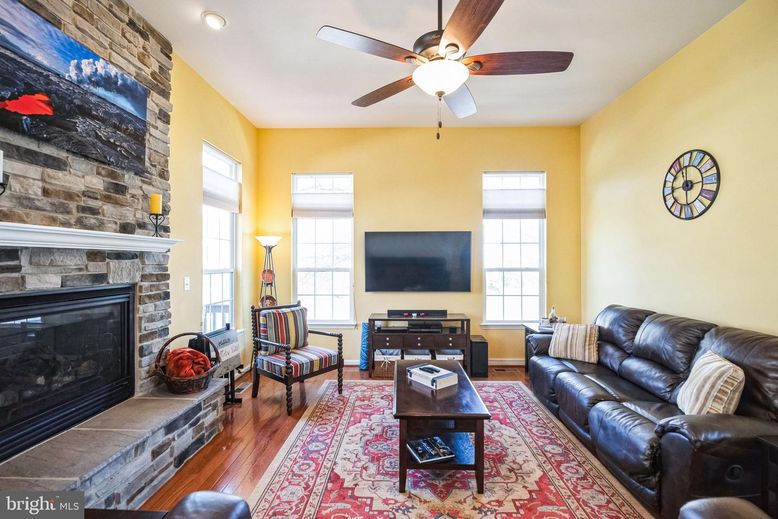 Fireplace, Interior, Living room, Recessed Lighting, Stone Walls, Wood Texture Flooring