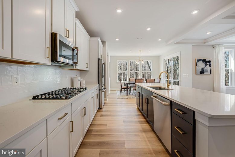 Chandelier, Dining room, Interior, Kitchen, Pendant Lights, Recessed Lighting, Stainless Steel Appliances, Wood Texture Flooring