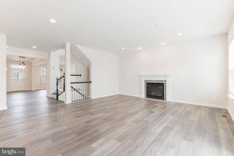 Empty room, Fireplace, Interior, Pendant Lights, Recessed Lighting, Wood Texture Flooring