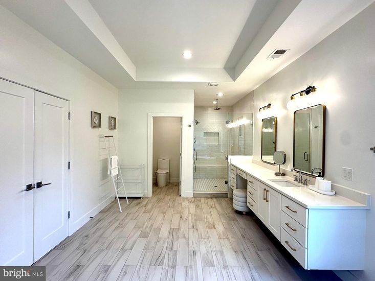 Bathroom, Dual Sink Vanities, Glass Shower, Interior, Recessed Lighting, Wood Texture Flooring