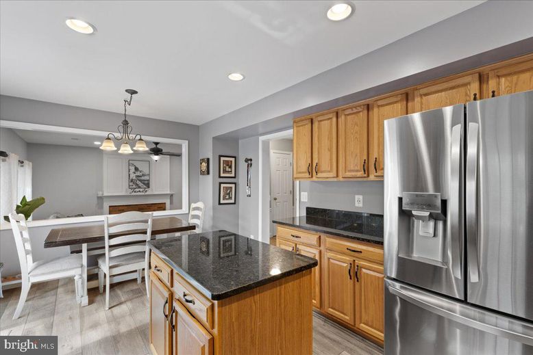 Chandelier, Dining room, Interior, Kitchen, Pendant Lights, Recessed Lighting, Stainless Steel Appliances, Wood Texture Flooring
