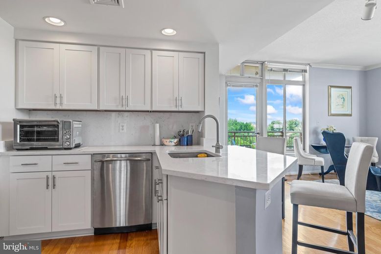 Dining room, Interior, Kitchen, Recessed Lighting, Stainless Steel Appliances, Wood Texture Flooring
