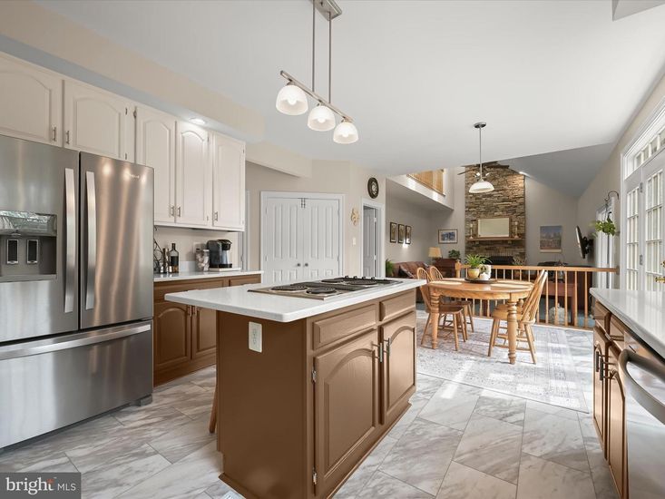 Dining room, Fireplace, Interior, Kitchen, Marble, Pendant Lights, Stainless Steel Appliances, Stone Walls