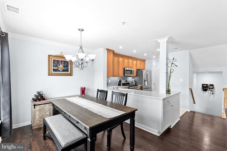 Chandelier, Dining room, Interior, Kitchen, Recessed Lighting, Stainless Steel Appliances, Wood Texture Flooring