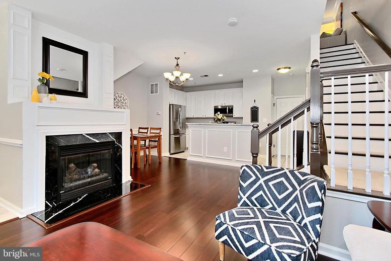 Chandelier, Dining room, Fireplace, Interior, Kitchen, Recessed Lighting, Stainless Steel Appliances, Wood Texture Flooring