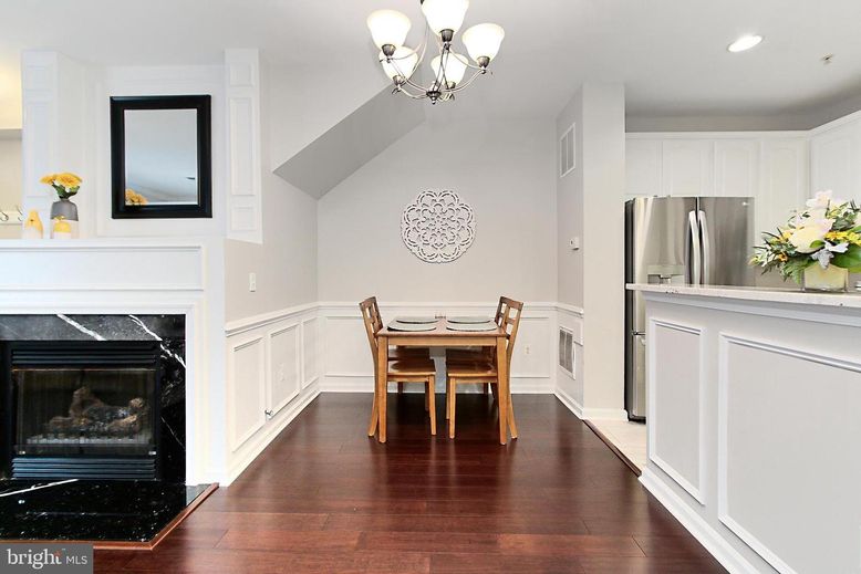 Chandelier, Dining room, Fireplace, Interior, Kitchen, Recessed Lighting, Stainless Steel Appliances, Wood Texture Flooring