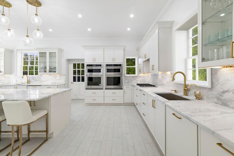 Interior, Kitchen, Marble Walls, Pendant Lights, Recessed Lighting, Stainless Steel Appliances, Wood Texture Flooring