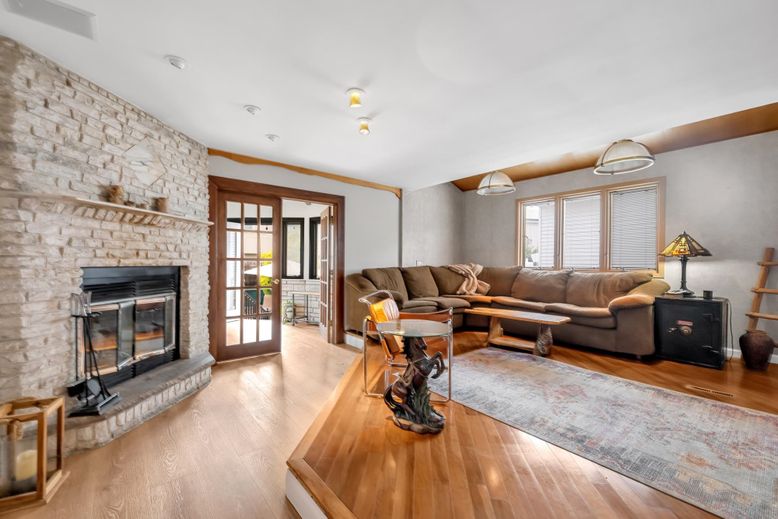 Fireplace, Interior, Living room, Recessed Lighting, Stone Walls, Wood Texture Flooring