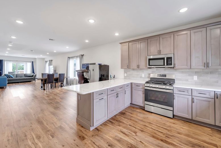 Dining room, Interior, Kitchen, Living room, Recessed Lighting, Stainless Steel Appliances, Wood Texture Flooring