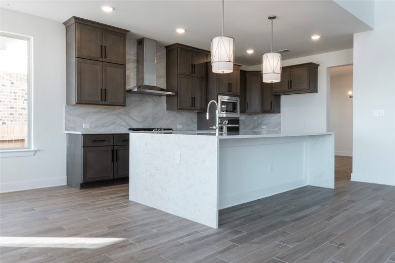 Interior, Kitchen, Marble Walls, Pendant Lights, Recessed Lighting, Stainless Steel Appliances, Wood Texture Flooring