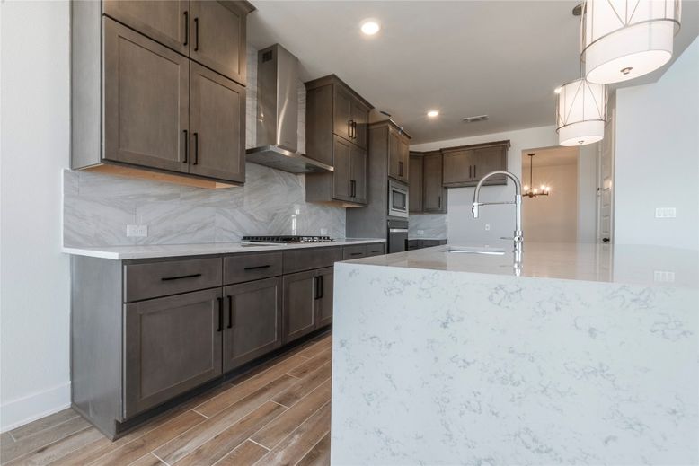 Interior, Kitchen, Marble Walls, Pendant Lights, Recessed Lighting, Wood Texture Flooring