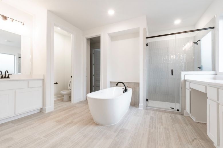 Bathroom, Dual Sink Vanities, Free Standing Baths, Glass Shower, Interior, Recessed Lighting, Wood Texture Flooring