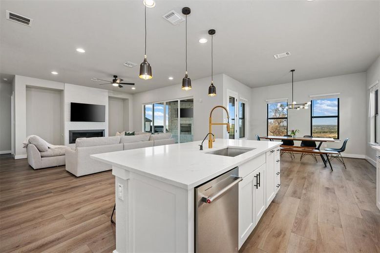 Dining room, Fireplace, Interior, Kitchen, Living room, Pendant Lights, Recessed Lighting, Stainless Steel Appliances, Wood Texture Flooring