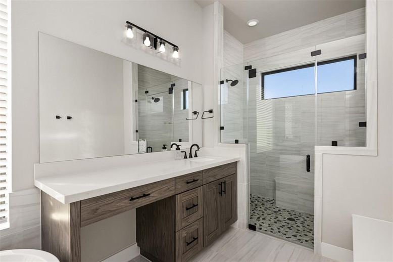 Bathroom, Dual Sink Vanities, Glass Shower, Interior, Recessed Lighting, Wood Texture Flooring