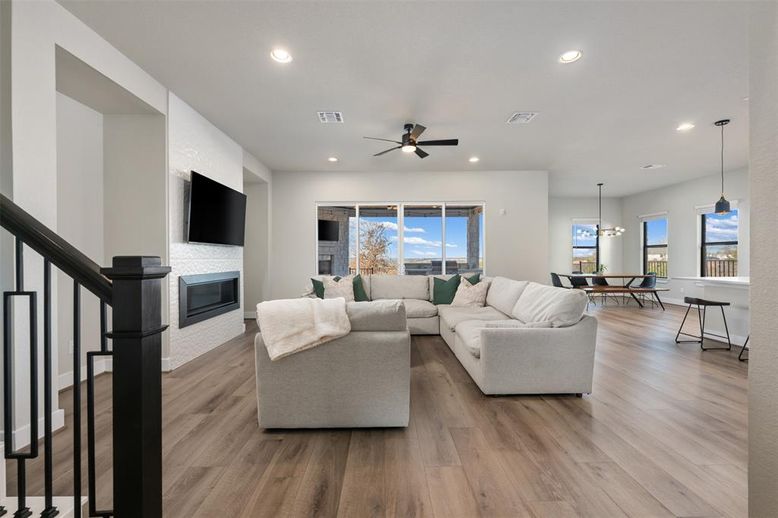 Dining room, Fireplace, Interior, Living room, Pendant Lights, Recessed Lighting, Wood Texture Flooring