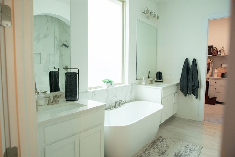 Bathroom, Dual Sink Vanities, Free Standing Baths, Interior, Marble Walls, Wood Texture Flooring