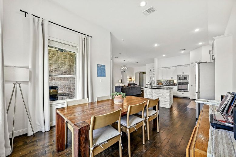 Chandelier, Dining room, Interior, Kitchen, Pendant Lights, Recessed Lighting, Stainless Steel Appliances, Wood Texture Flooring