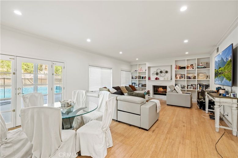 Dining room, Fireplace, Interior, Living room, Recessed Lighting, Water, Wood Texture Flooring